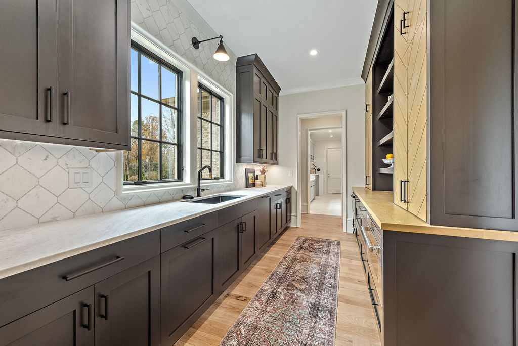 The Estate in Charlotte is a luxurious home showcasing stunning living spaces and amenities now available for sale. This home located at 6015 Lansing Dr, Charlotte, North Carolina; offering 05 bedrooms and 05 bathrooms with 5,712 square feet of living spaces.