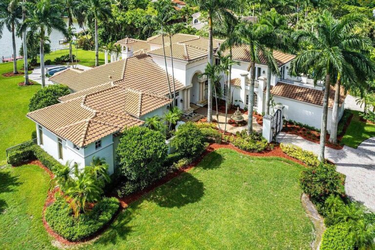This $5 Million Beautiful Home is Built on Over an Acre of Long Lake Estates’ Best Lakefront Lots in Boca Raton, Florida with Views of the Pool Deck Landscaping to the Lake