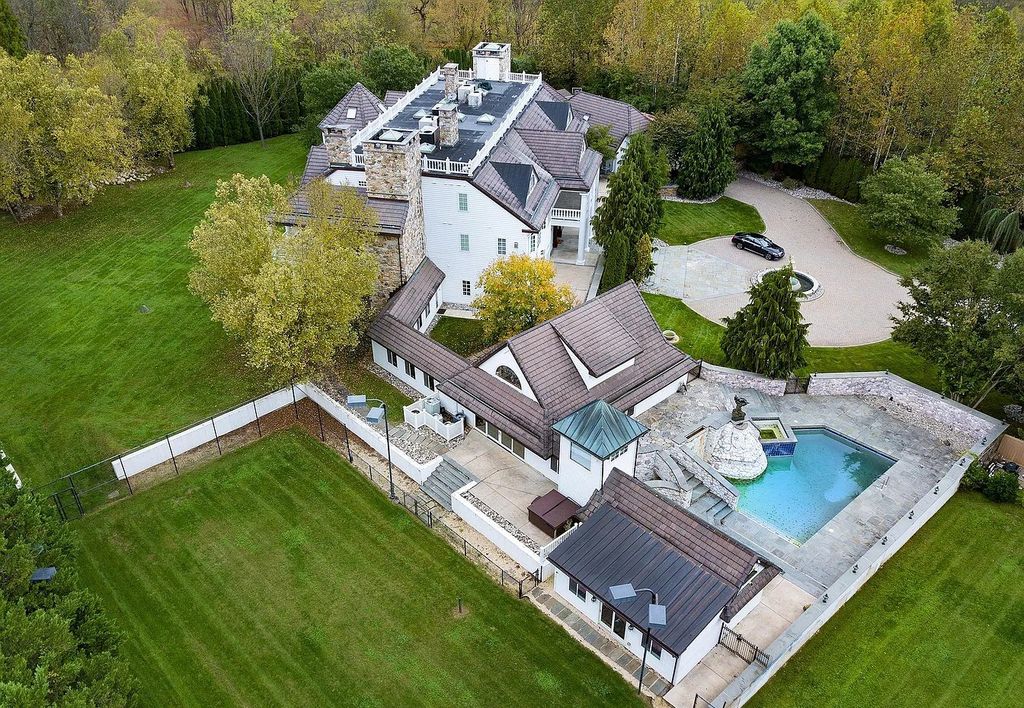 The Residence in Malvern offers three stories of luxury-filled living with breathtaking mountain views, now available for sale. This home located at 1494 Treeline Dr, Malvern, Pennsylvania