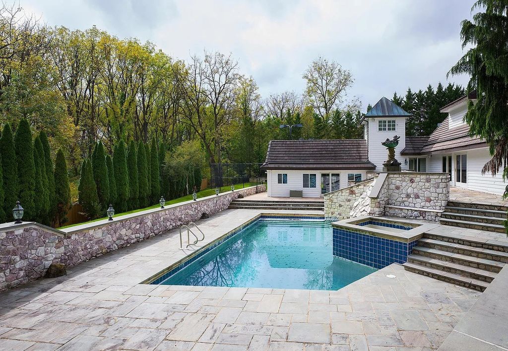 The Residence in Malvern offers three stories of luxury-filled living with breathtaking mountain views, now available for sale. This home located at 1494 Treeline Dr, Malvern, Pennsylvania