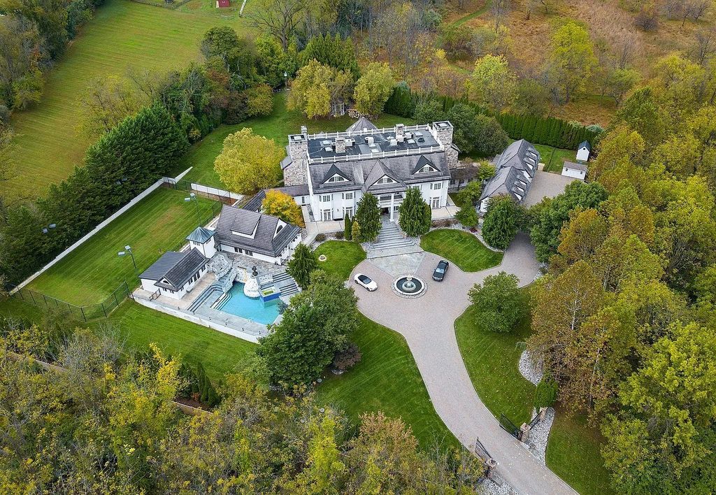 The Residence in Malvern offers three stories of luxury-filled living with breathtaking mountain views, now available for sale. This home located at 1494 Treeline Dr, Malvern, Pennsylvania