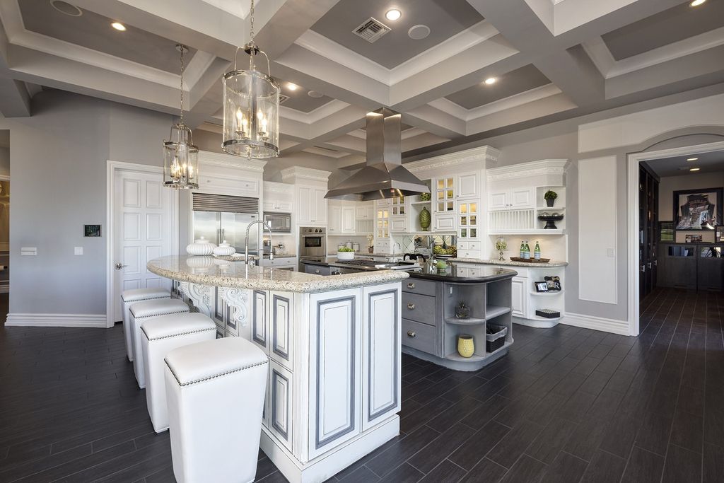 1513 Villa Rica Drive, Henderson, Nevada is a chic home in the Estates in Seven Hills with resort amenities including indoor-outdoor bar, movie theater, smart home, entertainers kitchen, bar seating, chic mirrored backsplash and more.