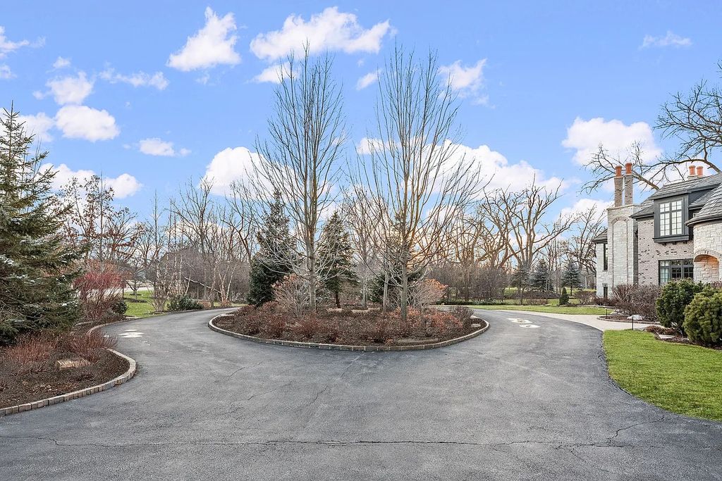 The Home in Bannockburn is a stunning mixture of stone, brick, and stucco, now available for sale. This home located at 21 Aberdeen Ct, Bannockburn, Illinois