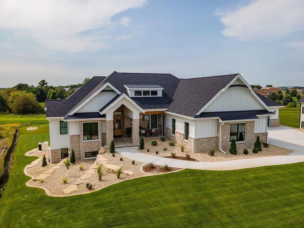 The Estate in Sun Prairie is a luxurious home fully finished in every meticulous and through detail now available for sale. This home located at 6635 Wagners Vineyard Tr, Sun Prairie, Wisconsin; offering 05 bedrooms and 07 bathrooms with 6,094 square feet of living spaces.