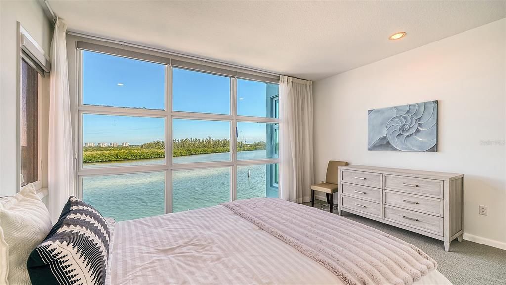 9137 Midnight Pass Road, Sarasota, Florida, is designed by the original owner and architect, Tony Ngai, and features expansive bay views from north to south on a quiet stretch.