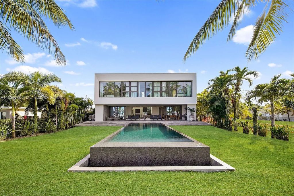 305 N Shore Drive, Miami Beach, Florida, is located in the secure, gated community of Normandy Shores, with 24-hour security. It features luxurious finishes and energy-efficient solar panels.