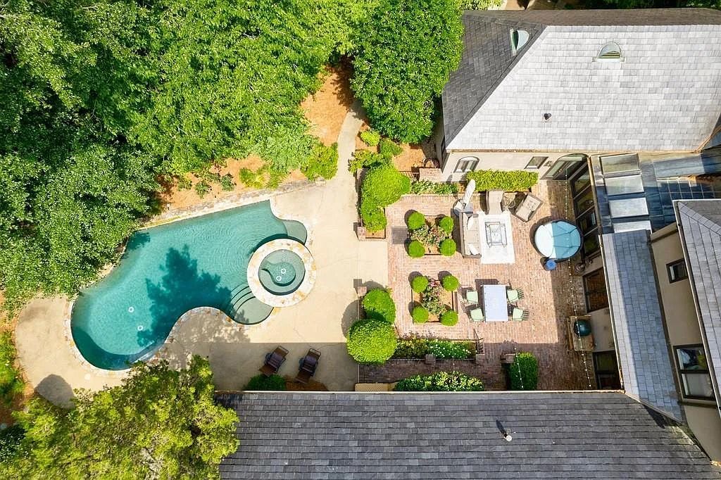 The Masterpiece in Atlanta highlights include flat, private lot with pool, parterre garden, terraces, grassy yard, front motor court, 3-car garage, now available for sale. This home located at 973 Peachtree Battle Ave NW, Atlanta, Georgia
