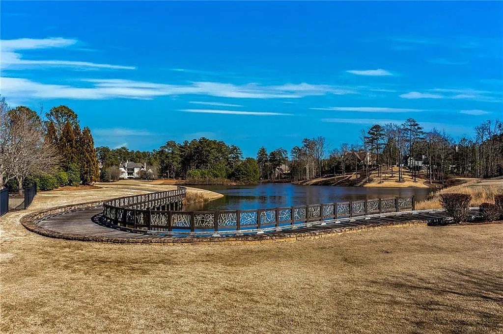 The House in Suwanee features an expansive professionally landscaped lot and tons of outdoor living space perfect for entertaining now available for sale. This home located at 918 Big Horn Holw, Suwanee,  Georgia