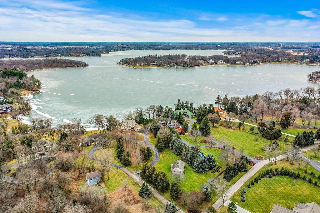 The Estate in Oconomowoc is a luxurious home with luxurious details throughout and unparalleled lakefront views now available for sale. This home located at 34595 Springbank Rd, Oconomowoc, Wisconsin; offering 04 bedrooms and 04 bathrooms with 5,694 square feet of living spaces.