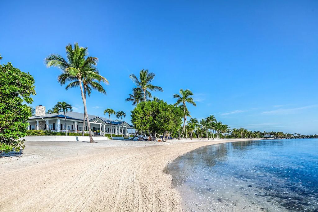 141 Cortez Drive, Lower Matecumbe Key, Florida, is one of a kind legacy property boasts three charming homes. Fall in love at first sight with over a quarter mile of pristine white sand beach that kisses the edge of the Atlantic Ocean.