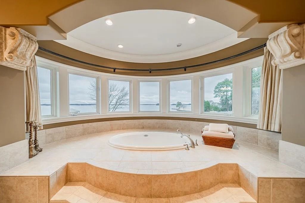 The Home in Cornelius features views from nearly every room, elevator, huge wine vault, multiple fireplaces, sauna, and more, now available for sale. This home located at 16339 Jetton Rd, Cornelius, North Carolina