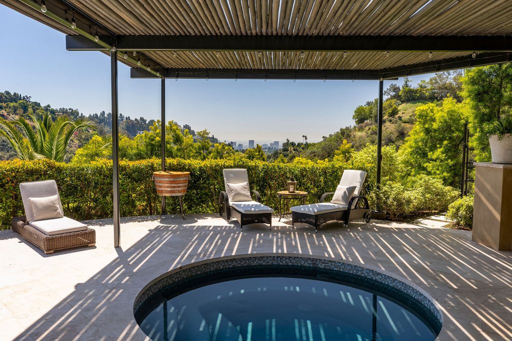 10702 Levico Way, Los Angeles, California is a sensational views villa with exceptional facade and romantic, verdant vines scaling its exterior. Magical setting offers a true escape without having to leave Bel-Air.