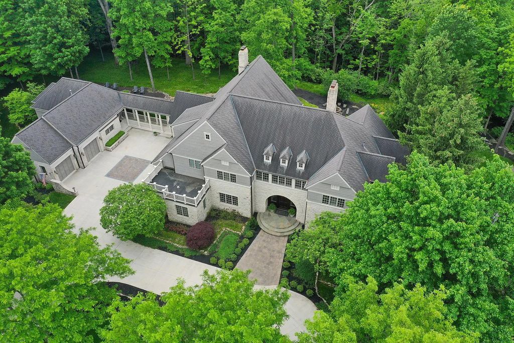 The Estate in Powell is a luxurious home providing grand living spaces with breathtaking woodland views and huge entertainment areas now available for sale. This home located at 1903 Strathshire Hall Ln, Powell, Ohio; offering 06 bedrooms and 08 bathrooms with 10,106 square feet of living spaces.