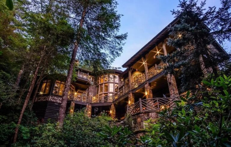 Flowering Landscaping, a Sparkling Waterfall, and Lush Forest, Another World Awaits in the Dream-Like $6,5M Property in Cashiers, NC