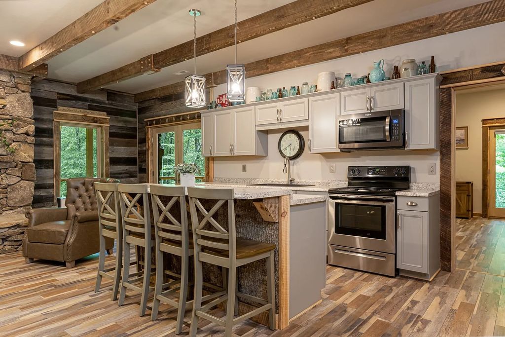 The Estate in Canton incorporates elements from the land with sustainable materials, now available for sale. This home located at 16 Gihon Waters Trl, Canton, North Carolina