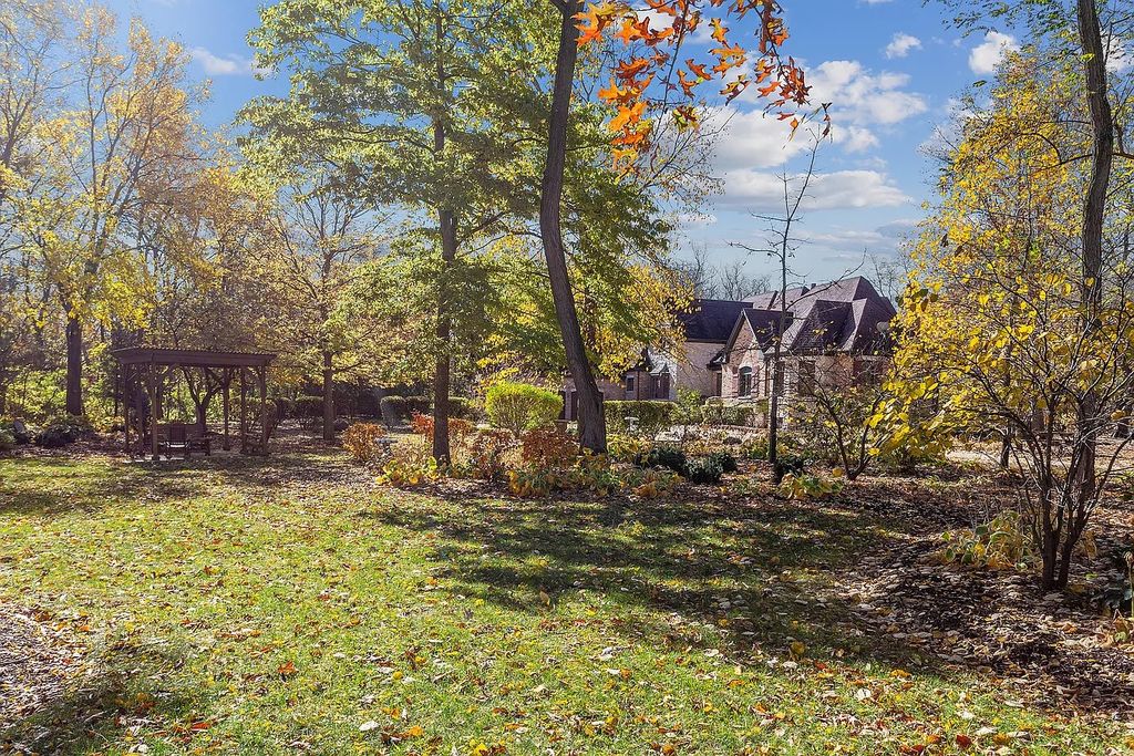 The Residence in Morris is surrounded by majestic, mature trees leading to your own private paradise, now available for sale. This home located at 4965 Cemetery Rd, Morris, Illinois