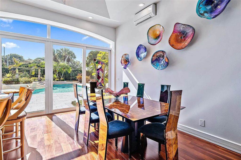 337 Eagle Drive, Jupiter, Florida, is like a jewel box with luxurious furnishings and private outdoor living space. It is perfect to have entertaining in family room with open kitchen and expansive views of the pool.