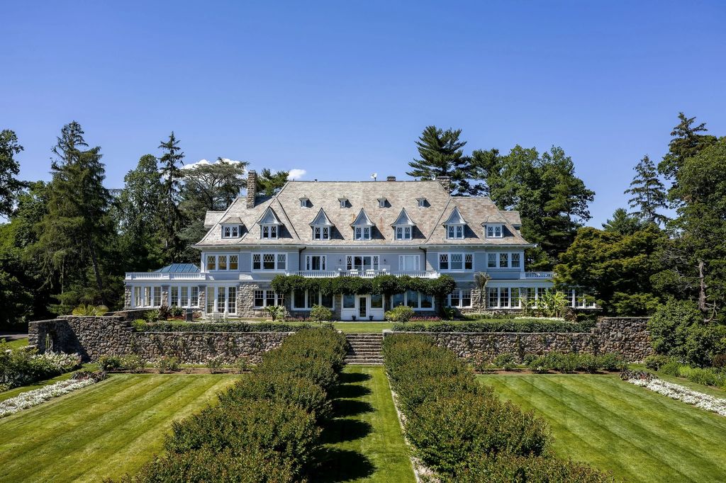 The Estate in Greenwich includes spectacular walled gardens, a swimming pool with spa, a grass tennis court and 2 private beaches, now available for sale. This home located at 499 Indian Field Rd, Greenwich, Connecticut