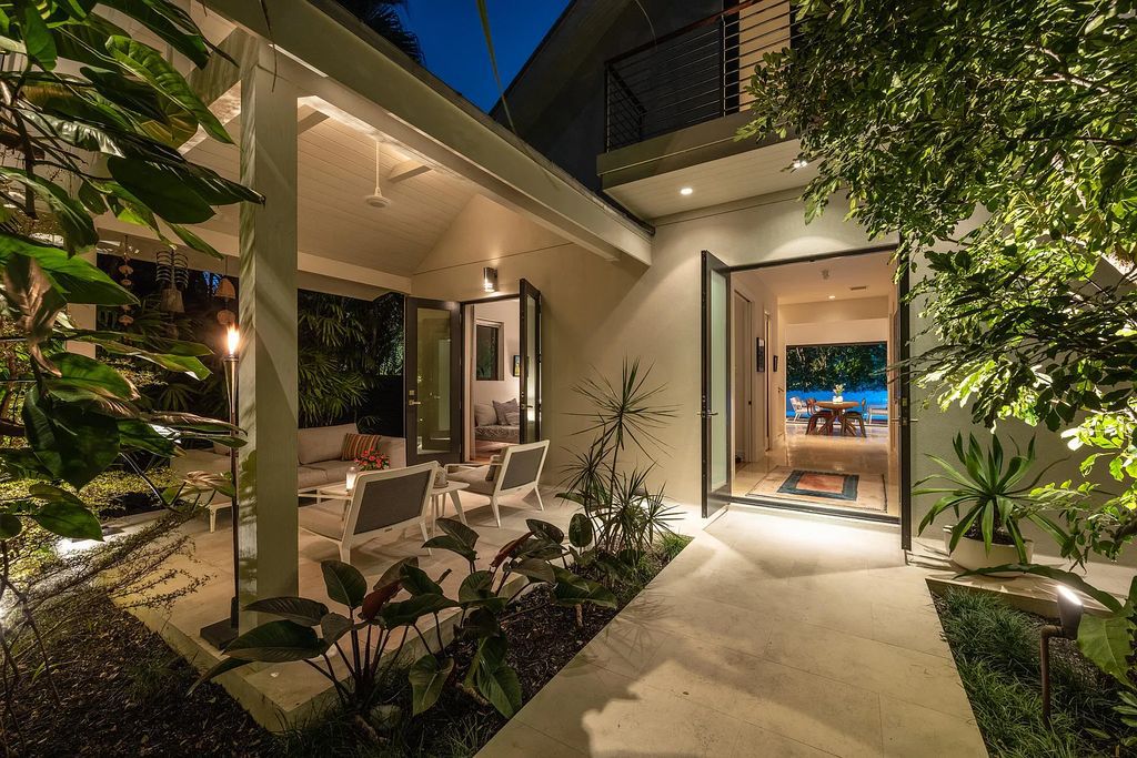 1025 Von Phister Street, Key West, Florida, is located in a sought-after neighborhood offering a tranquil escape. Both in the front and back yards, it is surrounded by lush tropical gardens.