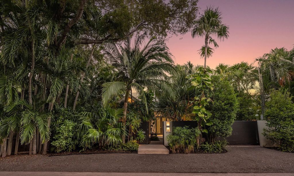 1025 Von Phister Street, Key West, Florida, is located in a sought-after neighborhood offering a tranquil escape. Both in the front and back yards, it is surrounded by lush tropical gardens.