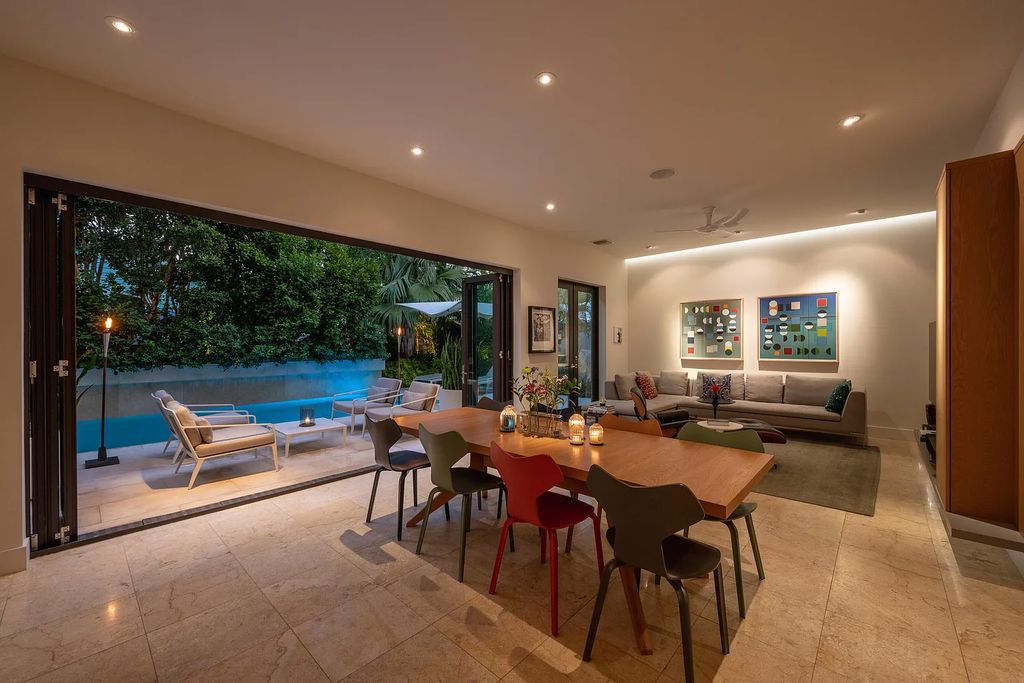 1025 Von Phister Street, Key West, Florida, is located in a sought-after neighborhood offering a tranquil escape. Both in the front and back yards, it is surrounded by lush tropical gardens.