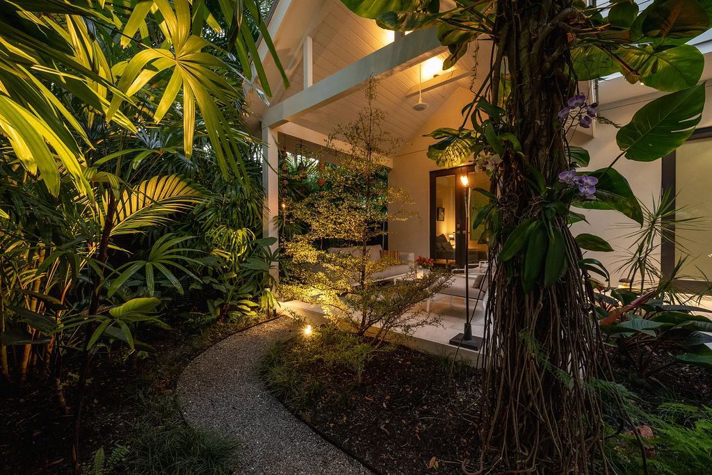 1025 Von Phister Street, Key West, Florida, is located in a sought-after neighborhood offering a tranquil escape. Both in the front and back yards, it is surrounded by lush tropical gardens.