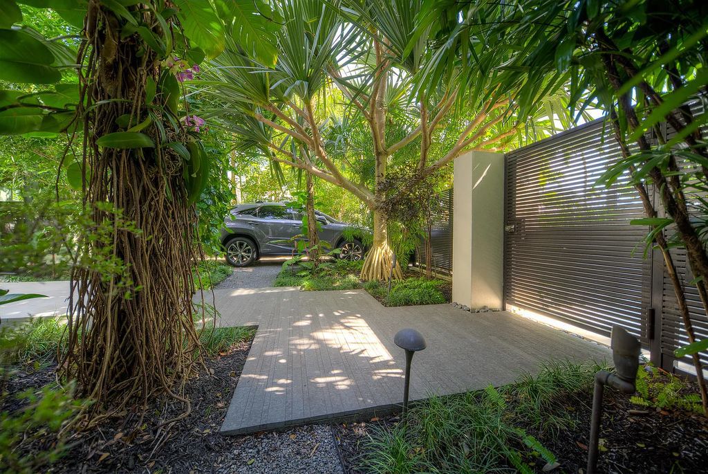 1025 Von Phister Street, Key West, Florida, is located in a sought-after neighborhood offering a tranquil escape. Both in the front and back yards, it is surrounded by lush tropical gardens.