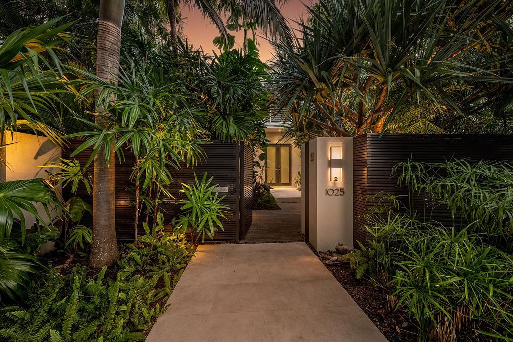 1025 Von Phister Street, Key West, Florida, is located in a sought-after neighborhood offering a tranquil escape. Both in the front and back yards, it is surrounded by lush tropical gardens.