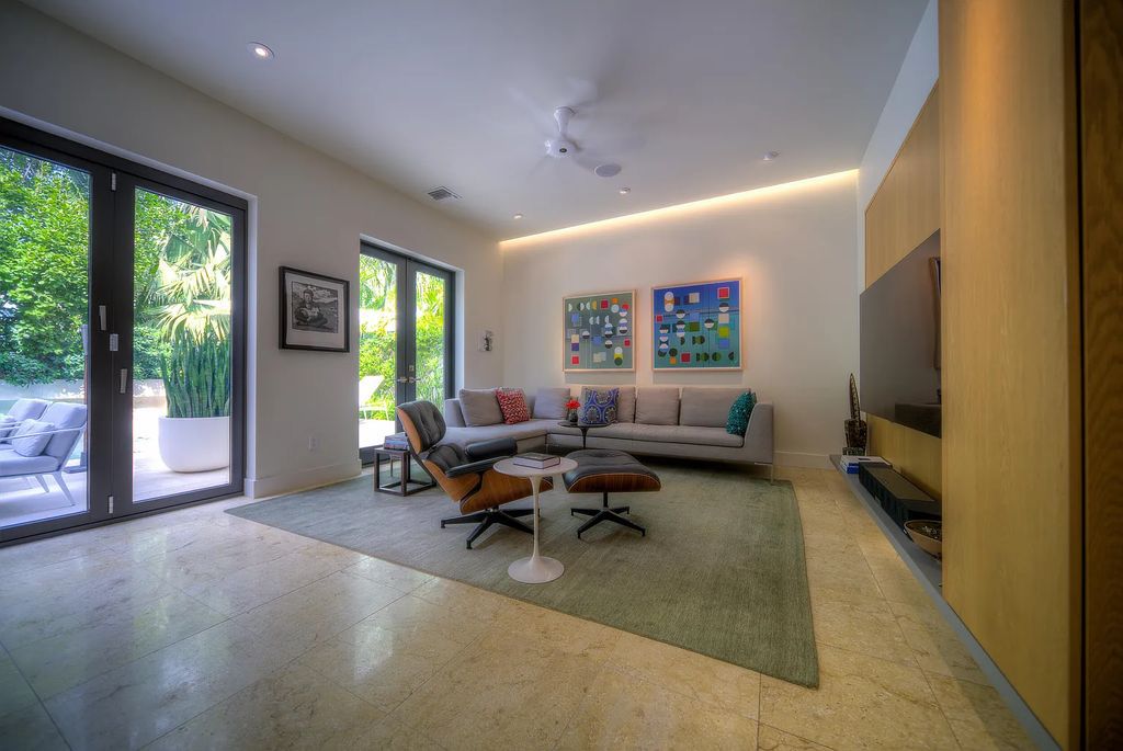 1025 Von Phister Street, Key West, Florida, is located in a sought-after neighborhood offering a tranquil escape. Both in the front and back yards, it is surrounded by lush tropical gardens.