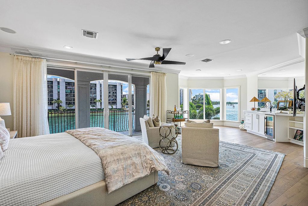 This exquisite 5 bedroom, 6 bathroom home is located on a prime waterfront lot in the highly sought-after area of Boca Raton, Florida. Built in 2003, 794 NE Harbour Drive boasts over 6,000 square feet of living space and sits on a spacious 0.22-acre lot. Upon entering the home, you'll be greeted by soaring ceilings and breathtaking water views that extend throughout the living areas, creating a bright and airy atmosphere.