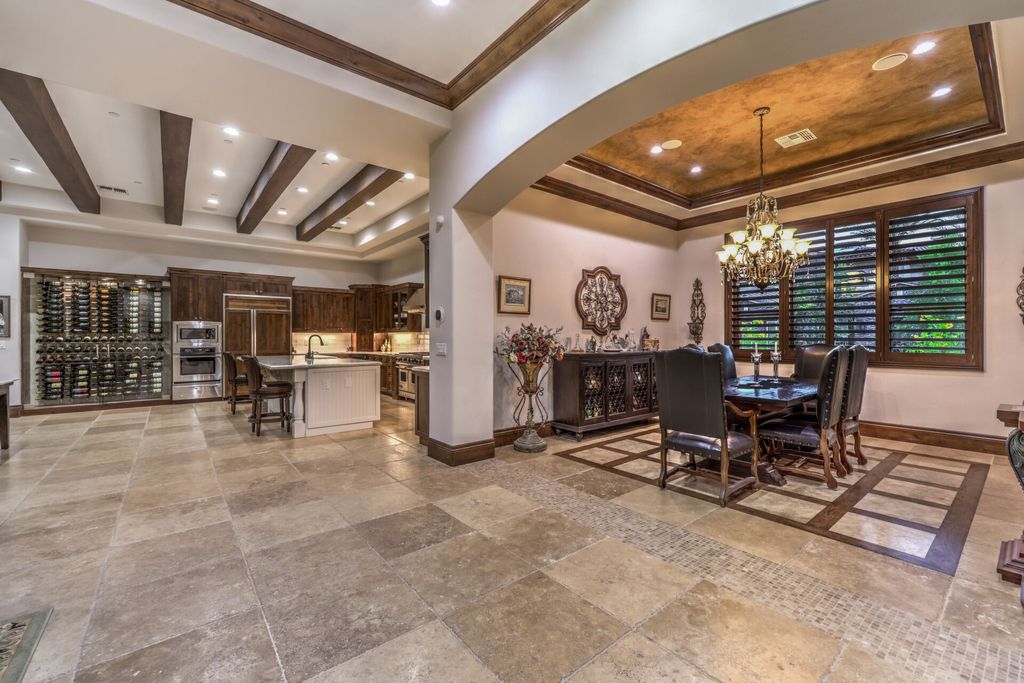 2599 Portovenere Place, Henderson, Nevada is a stunning custom 1 story Seven Hills estate in gated enclave with spectacular strip views from the expansive rooftop deck at the top of grand hills.