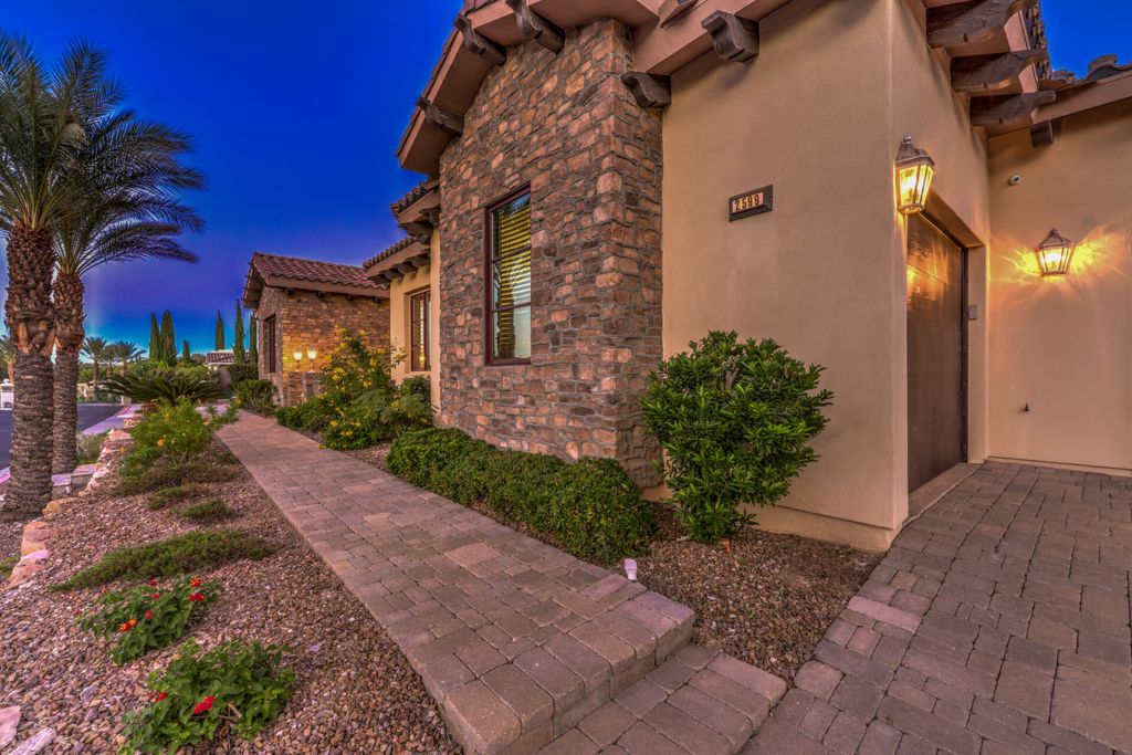 2599 Portovenere Place, Henderson, Nevada is a stunning custom 1 story Seven Hills estate in gated enclave with spectacular strip views from the expansive rooftop deck at the top of grand hills.