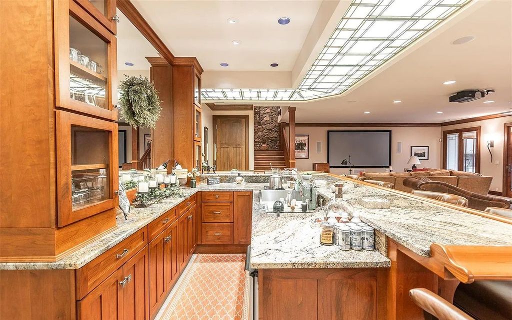 The Estate in Godfrey is a luxurious home with built-in lighting perfect for family fun, now available for sale. This home located at 702 Seiler Rd, Godfrey, Illinois