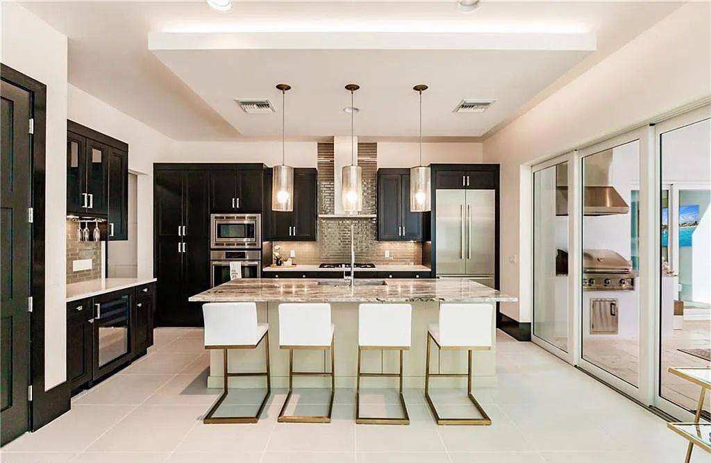 9214 Mercato Way, Naples, Florida, provides incredible specs and luxury furnishings. With the perfect outdoor living space, you can meander out the front door for morning yoga and coffee in seconds.
