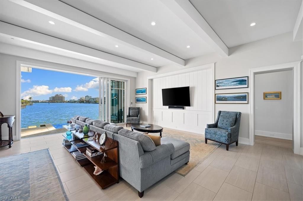 176 Bayview Avenue, Naples, Florida is an enchanting residence located just steps from Vanderbilt Beach off Gulf Shore Drive, a masterful collaboration between Stofft Cooney and BCB Homes for beach lovers and boaters alike. 