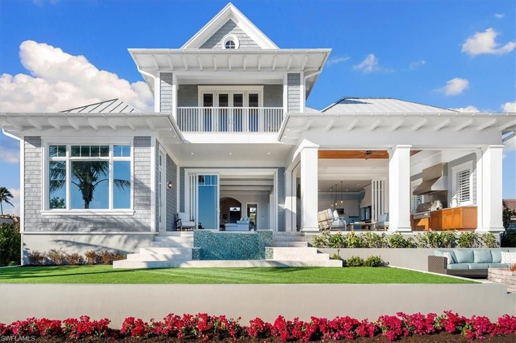 176 Bayview Avenue, Naples, Florida is an enchanting residence located just steps from Vanderbilt Beach off Gulf Shore Drive, a masterful collaboration between Stofft Cooney and BCB Homes for beach lovers and boaters alike. 