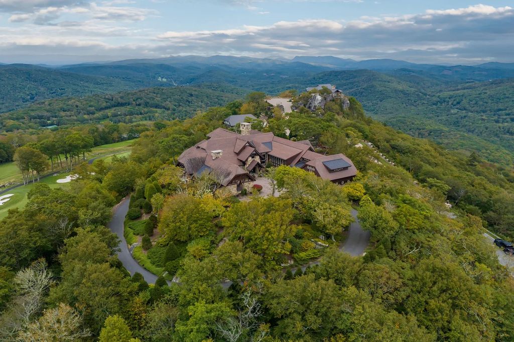 The House in Linville is a spectacular setting offering a entertaining space with views of Grandfather Mountain, now available for sale. This home located at 1907 Flattop Cliffs Ln, Linville, North Carolina