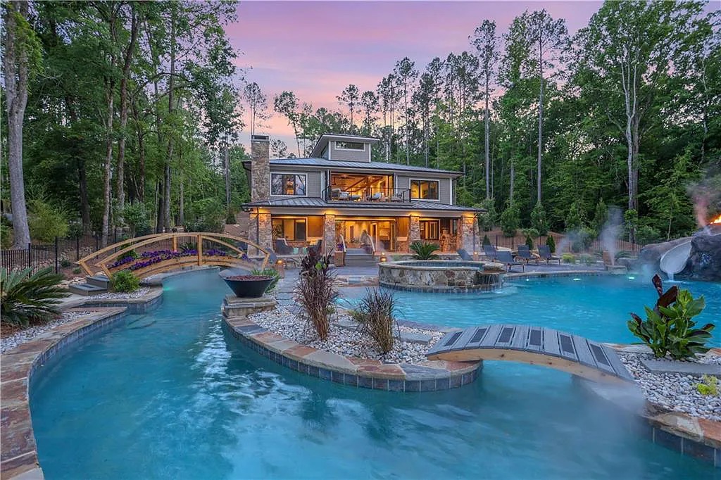 The Home in Greensboro features the most amazing “water-park” with a world-class swimming pool, lazy river, water-slide, waterfall, spa, now available for sale. This home located at 1381 Northwoods Dr, Greensboro, Georgia