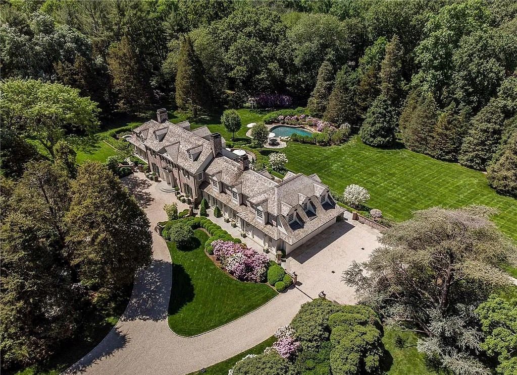 The Estate in New Canaan is an inspired Georgian style house privately set behind gates within 4.2 acres of beautifully landscaped garden, now available for sale. This home located at 1024 Smith Ridge Rd, New Canaan, Connecticut