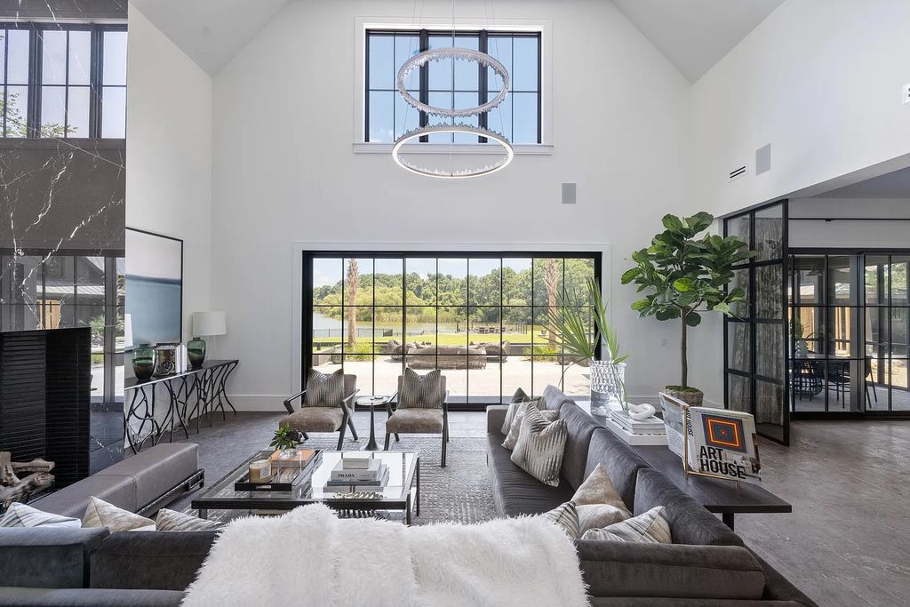 The Estate in Johns Island is a luxurious home offering a main house, two guest cottages, a pool and a custom cabana that all thoughtfully and beautifully designed in gated privacy now available for sale. 