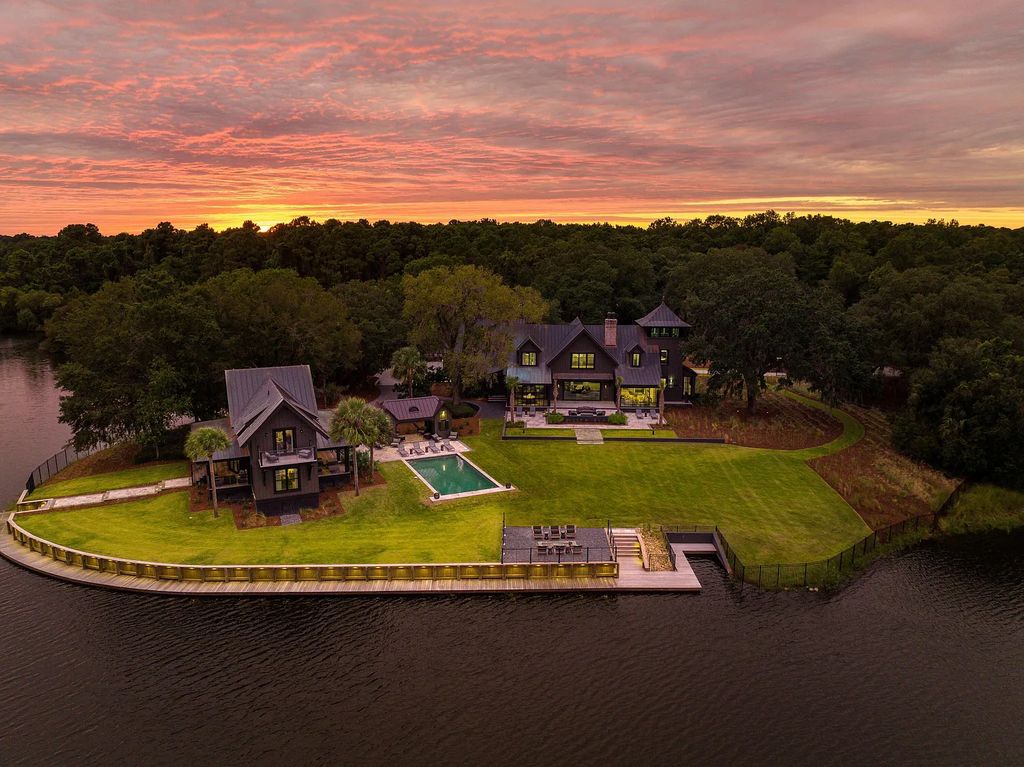 The Estate in Johns Island is a luxurious home offering a main house, two guest cottages, a pool and a custom cabana that all thoughtfully and beautifully designed in gated privacy now available for sale. 