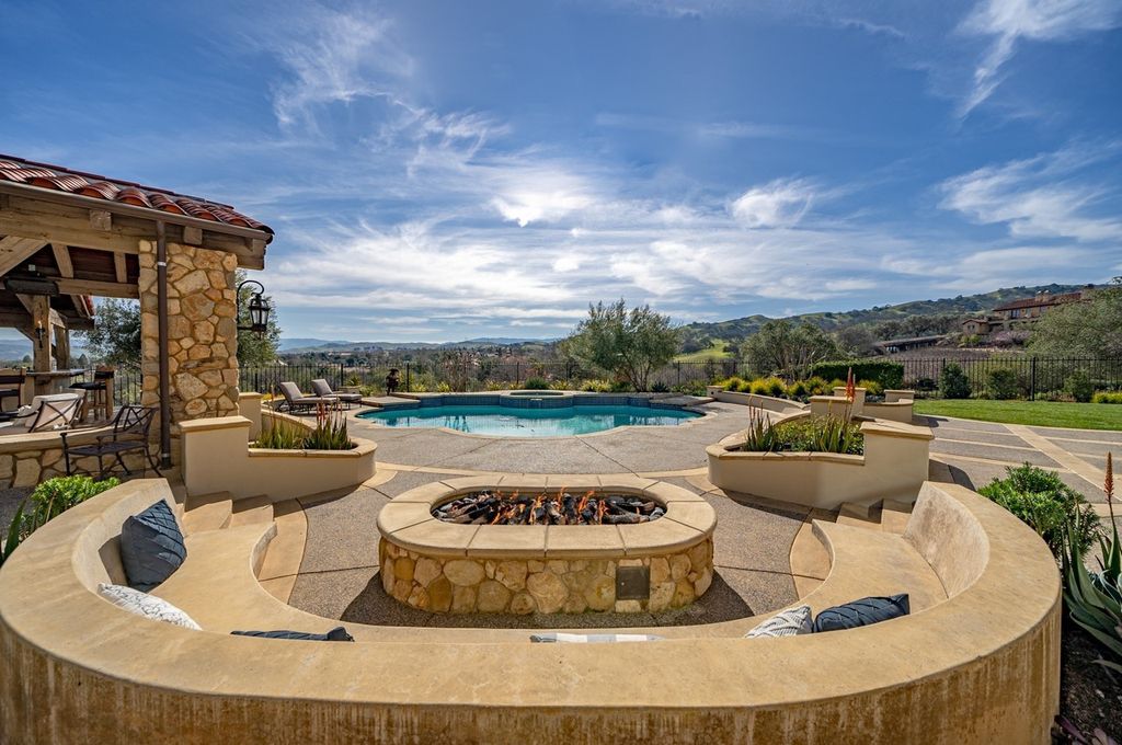 This Executive Estate is located at 1904 Zenato Pl, Pleasanton, California in the prestigious gated community of Ruby Hill, which features a Jack Nicklaus designed golf course. The property was built in 1999 and sits on a premium lot that measures 0.58 acres, offering breathtaking panoramic views of the Valley.