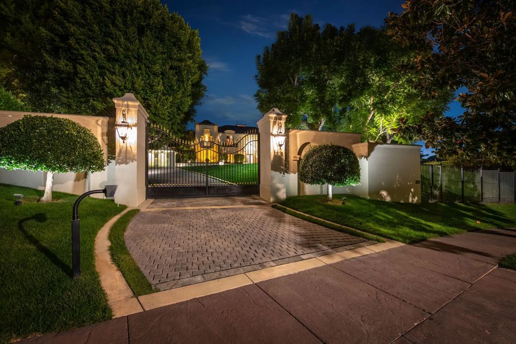 55 Beverly Park is a grand-scale residence located in the exclusive guard-gated enclave of Beverly Park. This luxurious estate, expertly designed by acclaimed architect Bob Ray Offenhauser, exudes an air of French Chateau meets Southern California living, and sits on 2.89 acres of romantic French-style garden landscaping.