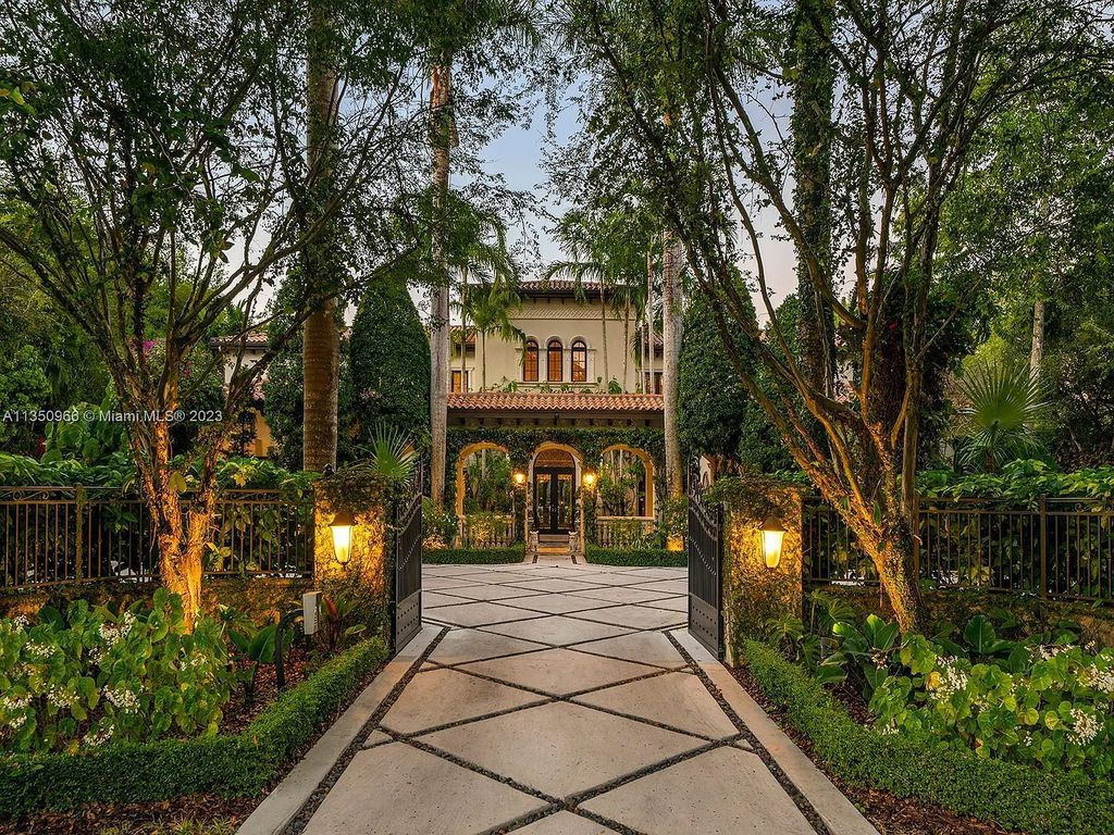 Experience the ultimate luxury living at 6655 SW 106th Street, Miami, Florida, where this enchanting tropical paradise is a true hidden gem, nestled in N Pinecrest surrounded by exotic green grounds. This stunning courtyd home welcomes you with water features, a grand foyer with dramatic staircase, and volume ceilings that exude luxury at its finest. 