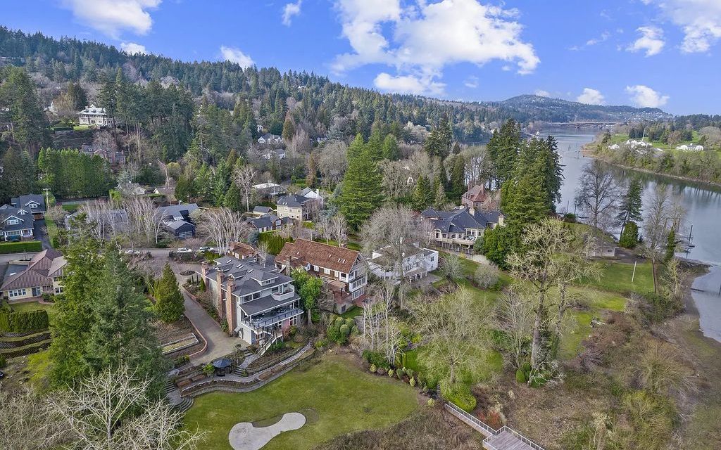 The Estate in Portland is a luxurious home offering grand scale spaces and generous room sizes now available for sale. This home located at 11614 S Riverwood Rd, Portland, Oregon; offering 05 bedrooms and 06 bathrooms with 7,607 square feet of living spaces. 