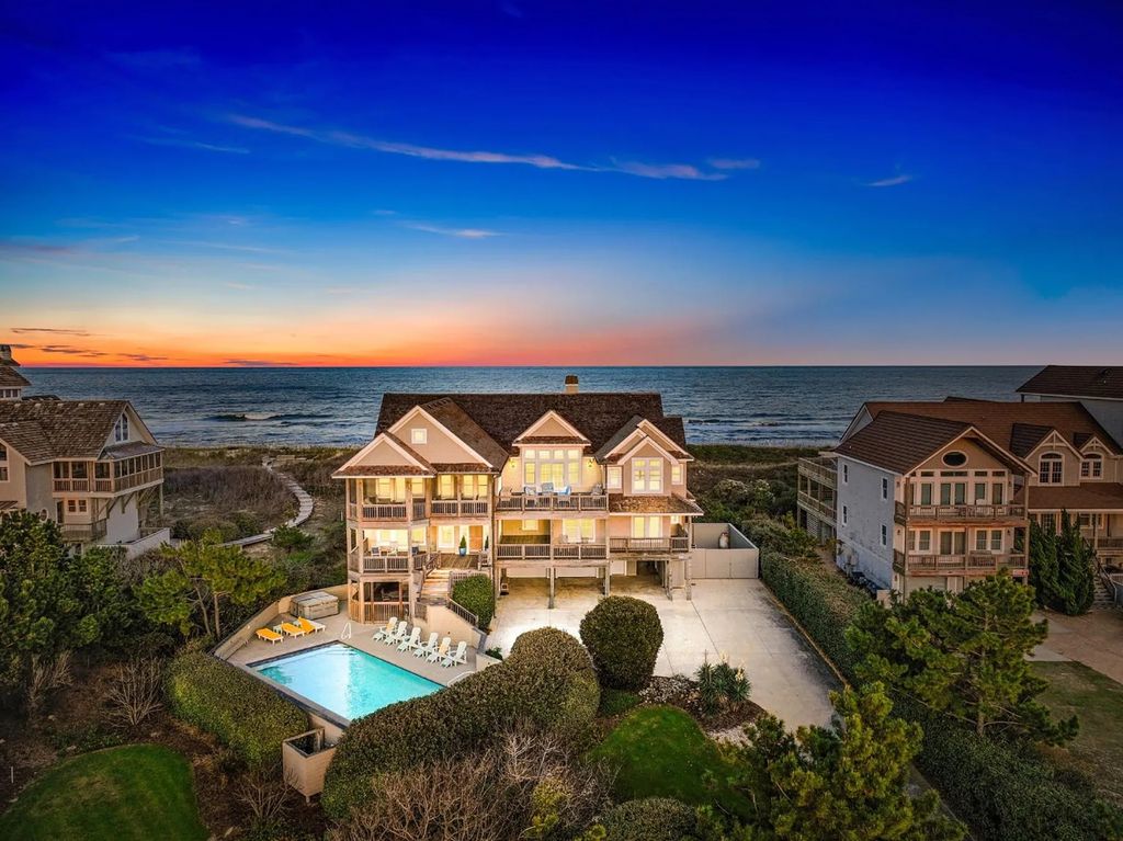 The Estate in Duck provides plenty of space for enjoying the sunrise over the ocean, now available for sale. This home located at 112 S Baum Trl, Duck, North Carolina