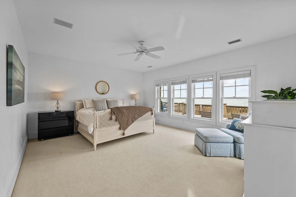 The Estate in Duck provides plenty of space for enjoying the sunrise over the ocean, now available for sale. This home located at 112 S Baum Trl, Duck, North Carolina