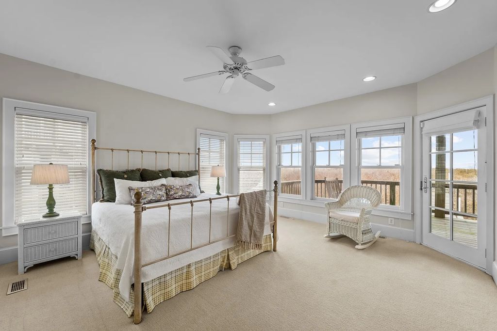 The Estate in Duck provides plenty of space for enjoying the sunrise over the ocean, now available for sale. This home located at 112 S Baum Trl, Duck, North Carolina