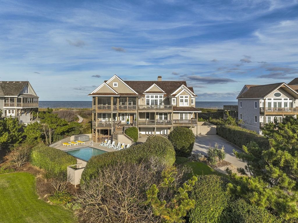 The Estate in Duck provides plenty of space for enjoying the sunrise over the ocean, now available for sale. This home located at 112 S Baum Trl, Duck, North Carolina