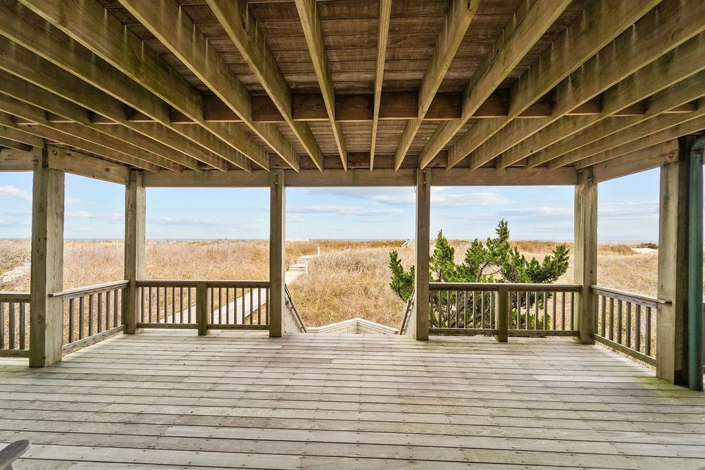 The Estate in Duck provides plenty of space for enjoying the sunrise over the ocean, now available for sale. This home located at 112 S Baum Trl, Duck, North Carolina